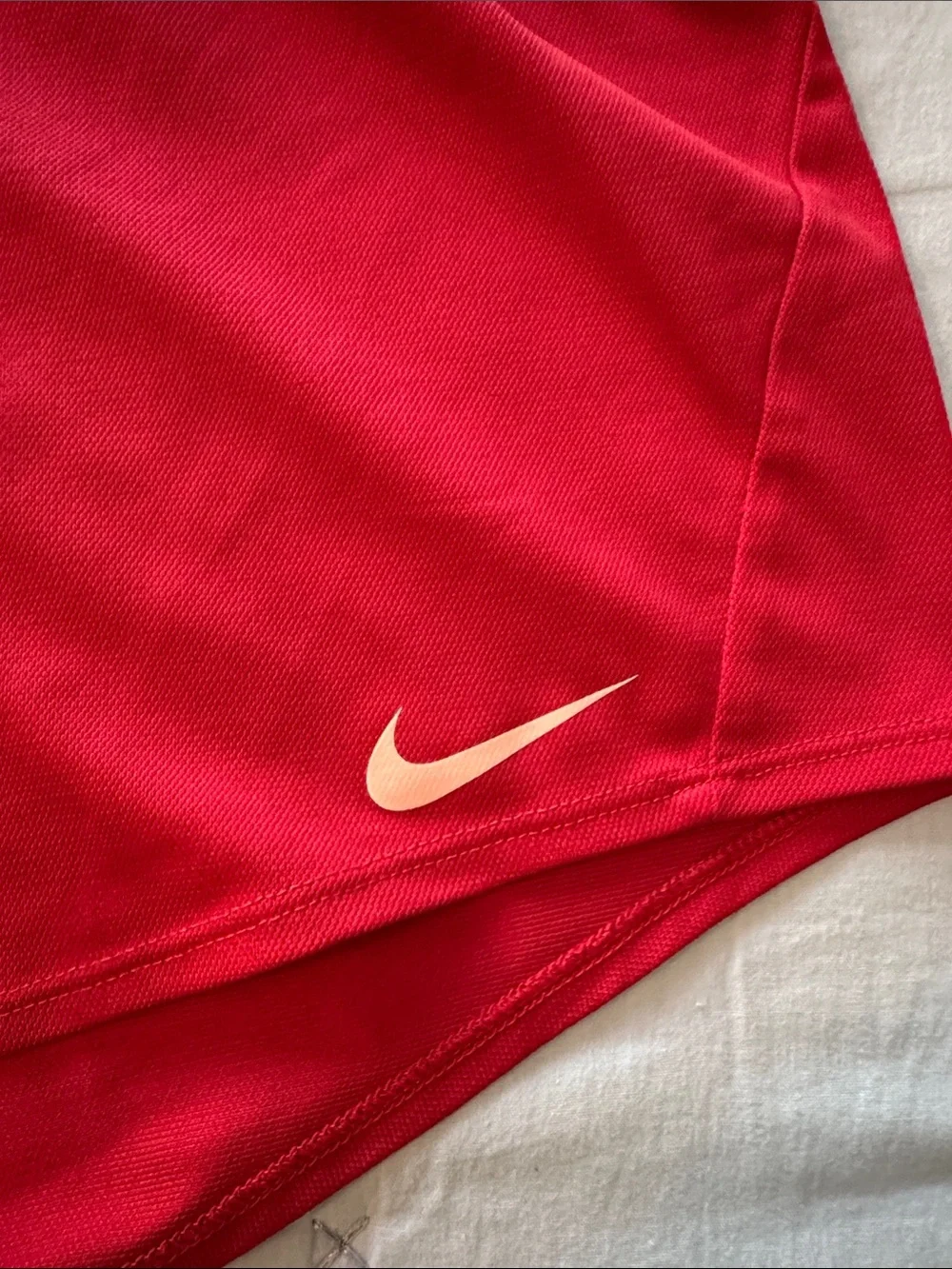 Nike Red Women's Athletic Running Shorts with peach Swoosh